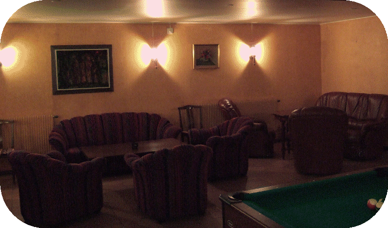 Sofas and billiardtable in the bar.